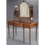 A reproduction inlaid-mahogany bow-front dressing table, fitted three frieze drawers with lion-