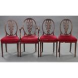 A set of four Edwardian mahogany dining chairs (including one carver), with pierced & shaped