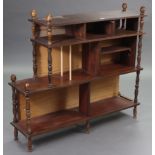 A mahogany standing open four-tier bookcase with turned supports, 47” wide x 42” high x 12¼” deep.