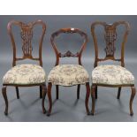 A Victorian carved beech balloon-back occasional chair with padded seat, & on cabriole legs (