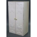 A white painted oak small upright cupboard fitted three shelves enclosed by pair of panel doors,