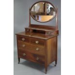 An Edwardian inlaid-mahogany dressing chest, with oval swing mirror to the stage back, fitted two