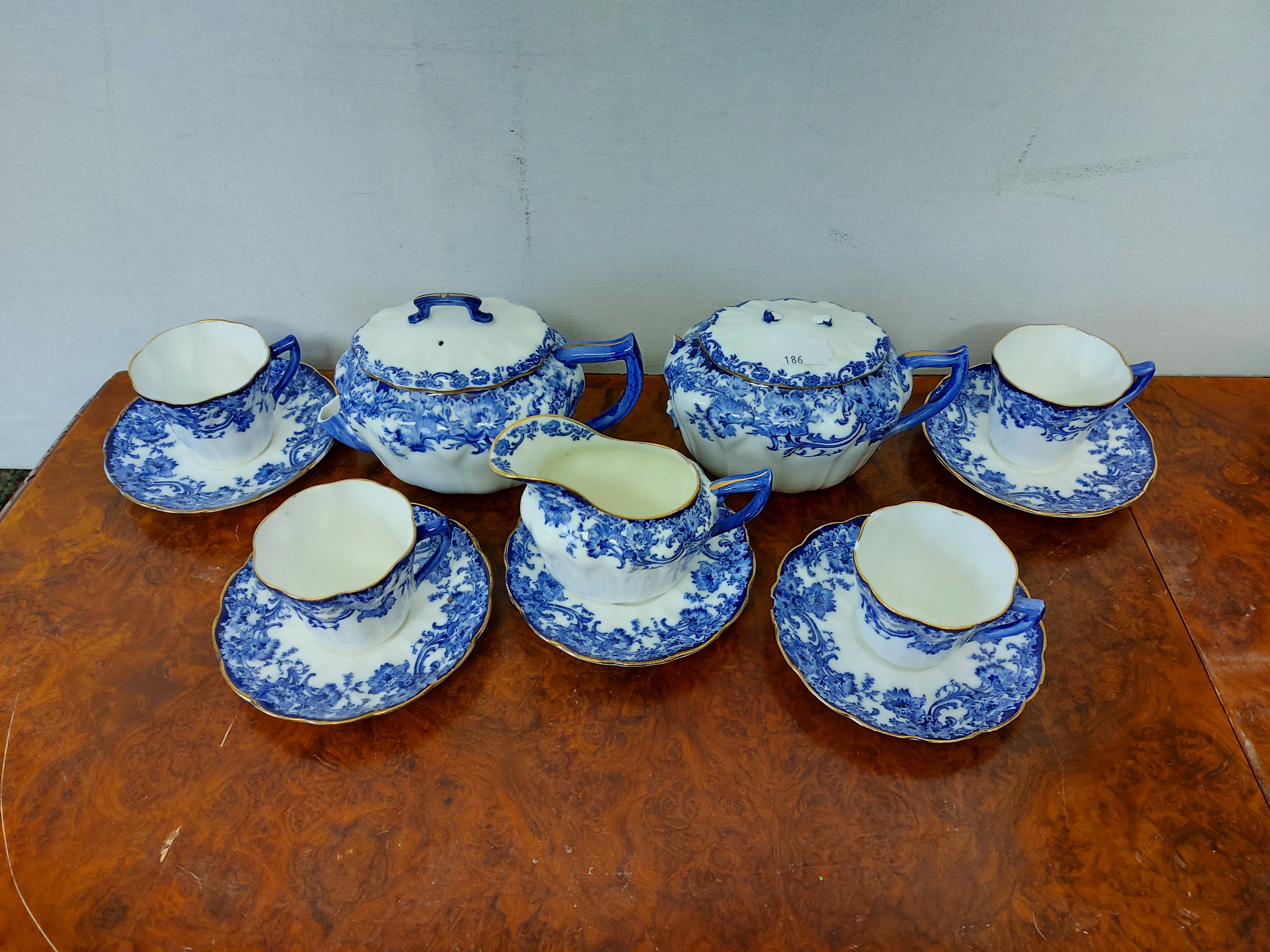 A Clarice Cliff “Crocus” pattern fruit bowl, 7¾” diam.; & a Doulton Burslem “Melrose” pattern twelve