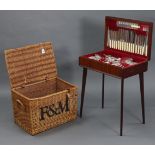 A Fortnum & Mason wicker hamper (lacking contents) 22” wide x 15” high; together with a canteen of