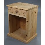 A pine bedside cabinet, fitted frieze drawers above an open recess, & on plinth base, 18¾” wide x