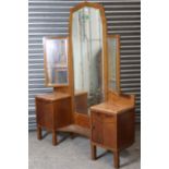 A mid-20th century oak dressing chest in the continental style, with triple panel mirror to the