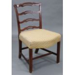 A Georgian mahogany ladder-back dining chair with padded serpentine-front seat, & on square