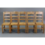 A set of five light oak rail-back dining chairs with hard seats, & on square legs with plain
