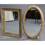 A rectangular gilt frame oval wall mirror, 31” x 24”; & an oval gilt frame wall mirror, 34” x 22” (