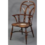 A Windsor-style ash & elm carver chair with pierced & shaped splats to the open back, with hard