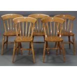 A set of five pine lath-back kitchen chairs with hard seats, & on turned legs with turned