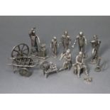 Seven various silvered-metal character figures, some with accessories.