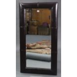 A large rectangular wall mirror inset bevelled plate, & in leather frame, 46½” x 24½”.