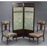 An early 20th century mahogany two-fold draught screen, with fret-work frieze, & each fold inset