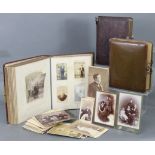 Two Victorian leather-bound family photograph albums containing numerous photographs; together