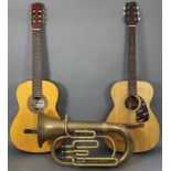 A Fender six-string acoustic guitar, another acoustic guitar (one with case); & a brass Euphonium (l