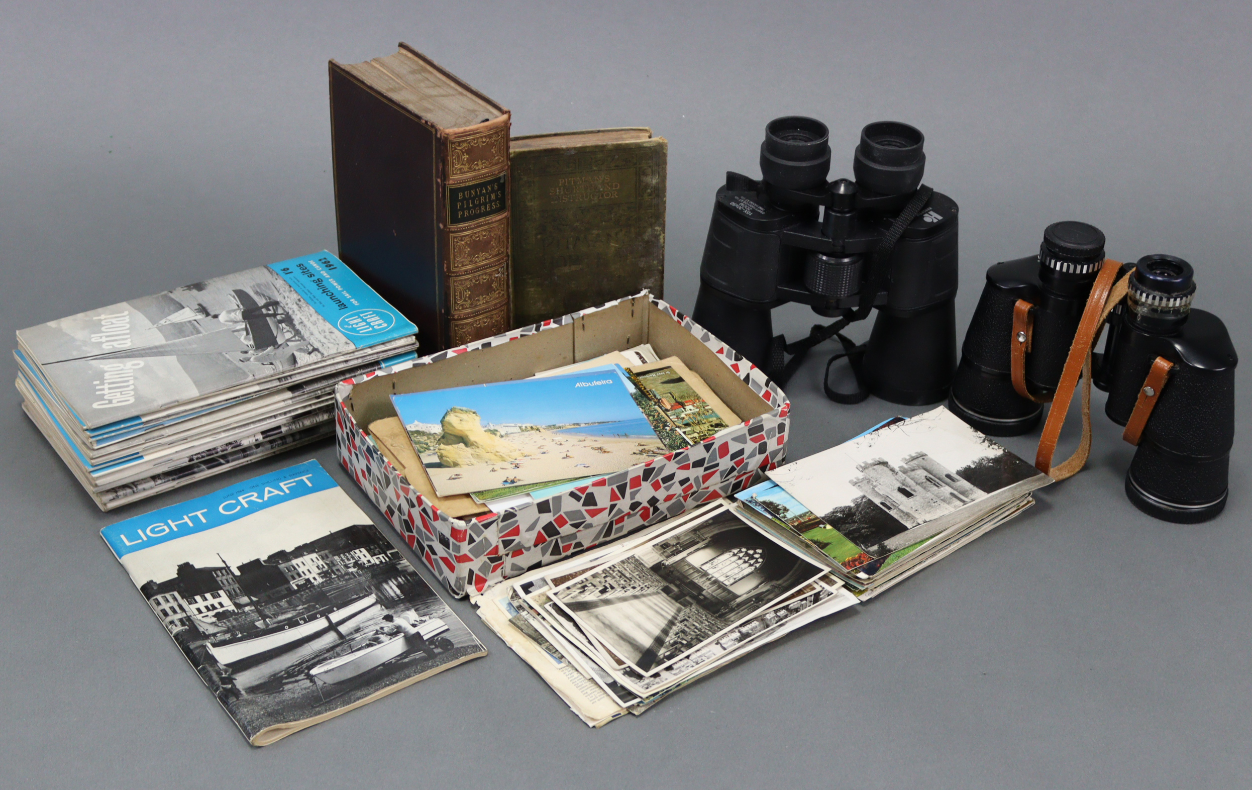 Two pairs of binoculars; together with various loose postcards, family photographs, etc.