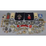 Fourteen various WWII British regiment cap badges; together with various ditto tunic buttons & cloth