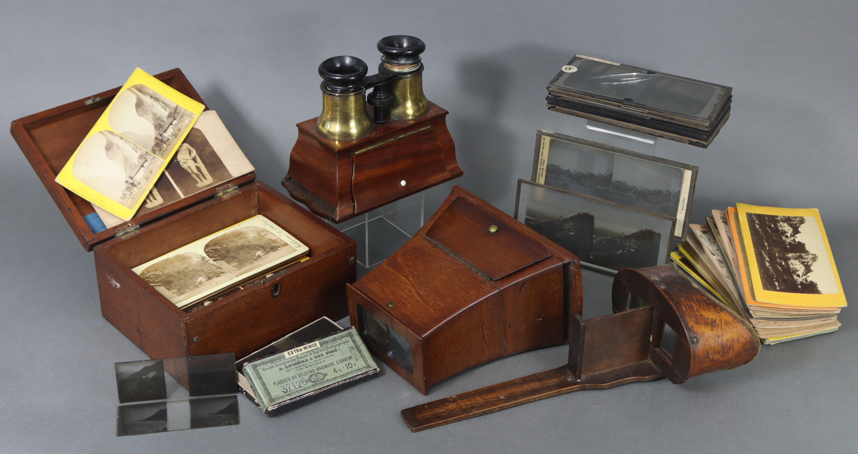 Four stereo-card viewers; a stereo-card storage box; & a quantity of stereoview cards.