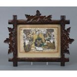 A Victorian Valentine’s day card in carved wooden frame with foliate border.