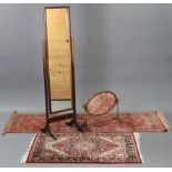 A mahogany rectangular cheval mirror on square supports, 58½” high; a similar oval swing dressing