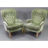 A pair of Victorian-style buttoned-back easy chairs upholstered pale green velour, & on beech turned