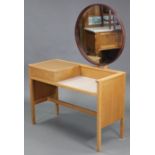 A light oak & white laminate dressing table with circular mirror to the stage back, with hinged