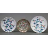 A Japanese pottery plate of white ground & with bright-coloured floral decoration, 12” diameter; a