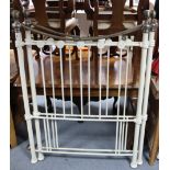 A pair of Victorian-style white tubular & silvered-metal single headboards.