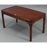 A mahogany rectangular tray-top low coffee table on four square chamfered legs, 42” wide x 20½” high
