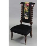 A Victorian beech-frame prie-dieu chair with padded seat & back, & on bobbin-turned legs with