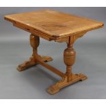 A Lebus oak draw-leaf dining table on bulbous-turned end supports joined by plain centre
