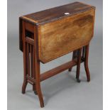 A late 19th century mahogany crossbanded Sutherland table with canted corners to the rectangular