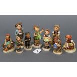 Nine Goebel Hummel figures including “Brother”, “For Mother”, “Sister”, “Spring Cheer”, etc.