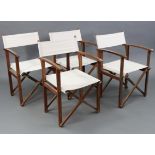 A set of four teak folding directors’ chairs.