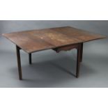 A 19th century mahogany drop-leaf dining table on four square chamfered legs, 48” x 60”.