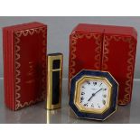 A Les Must de Cartier travelling alarm clock in octagonal gilt-metal case with “midnight-blue” &