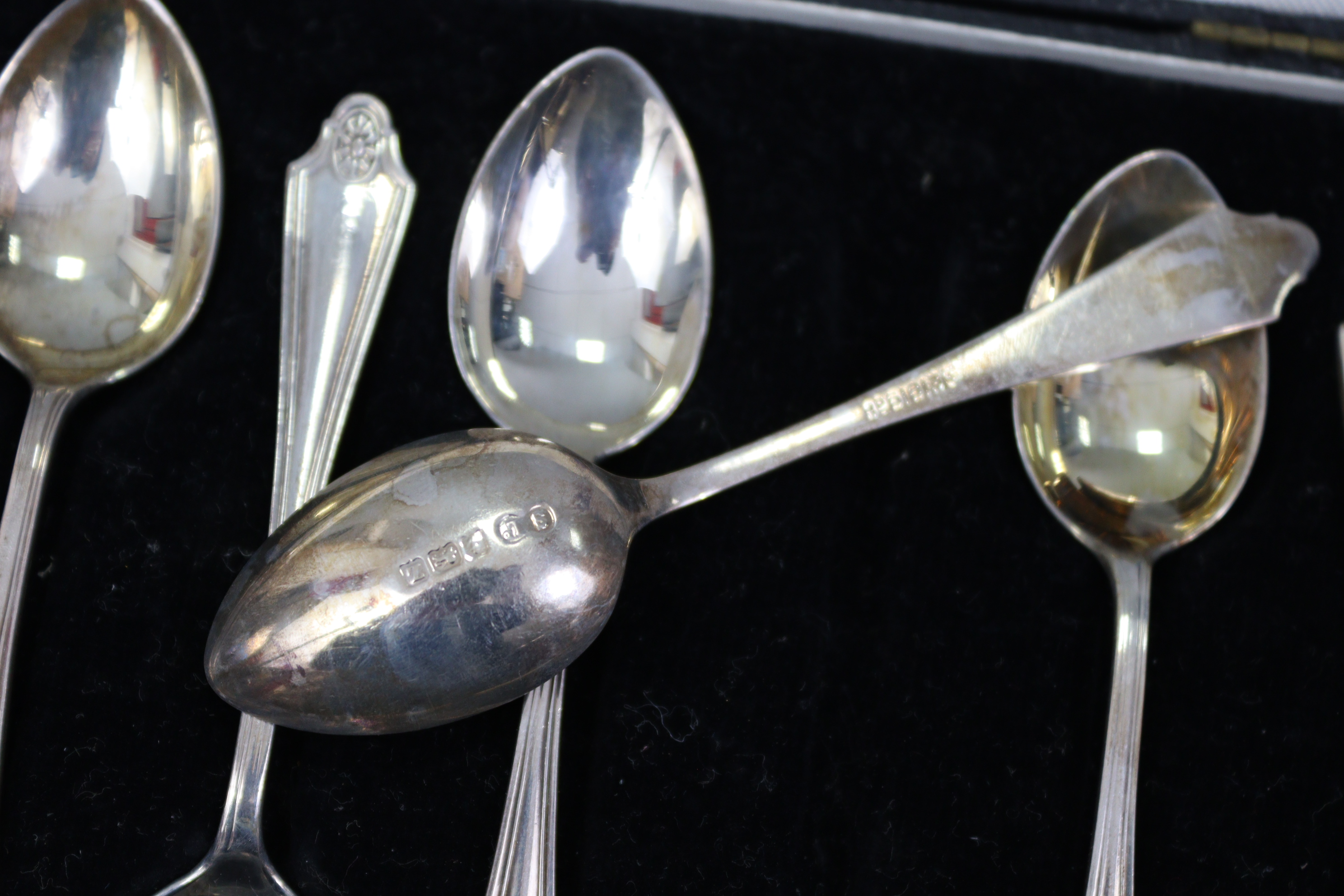 A set of six silver coffee spoons with oval petrae to the terminals, Birmingham 1924; & a set of six - Image 2 of 3