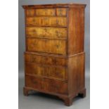 A GEORGE I FIGURED WALNUT CHEST-ON-CHEST, fitted three short & six long graduated drawers with later