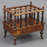 A Victorian rosewood canterbury of three divisions, with turned supports & spindle gallery fitted