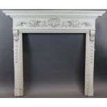 A Georgian-style white painted carved pine & composition fire surround with foliate & egg-&-dart