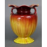 A Linthorpe pottery baluster vase with loop handles, wide foliate rim, & all-over flambé glaze, on