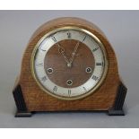 A Smiths Enfield chiming mantel clock with 6½” dial, three-train movement, in oak domed case; 9”