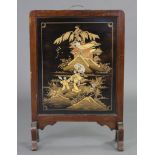 An early-mid 20th century Japanese firescreen, inset lacquer panel decorated with figures in a