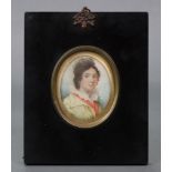 ENGLISH SCHOOL, early 19th century A head & shoulders portrait miniature of a young lady wearing
