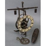 An iron skeleton-type wall timepiece with crown & verge movement, painted 5¼” diam. chapter ring