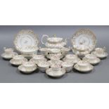 An early 19th century English porcelain thirty-two piece part tea & coffee service with scrolling g