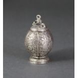 A 17th century CONTINENTAL SILVER POMANDER of ovoid form, with all-over decoration of flowers &
