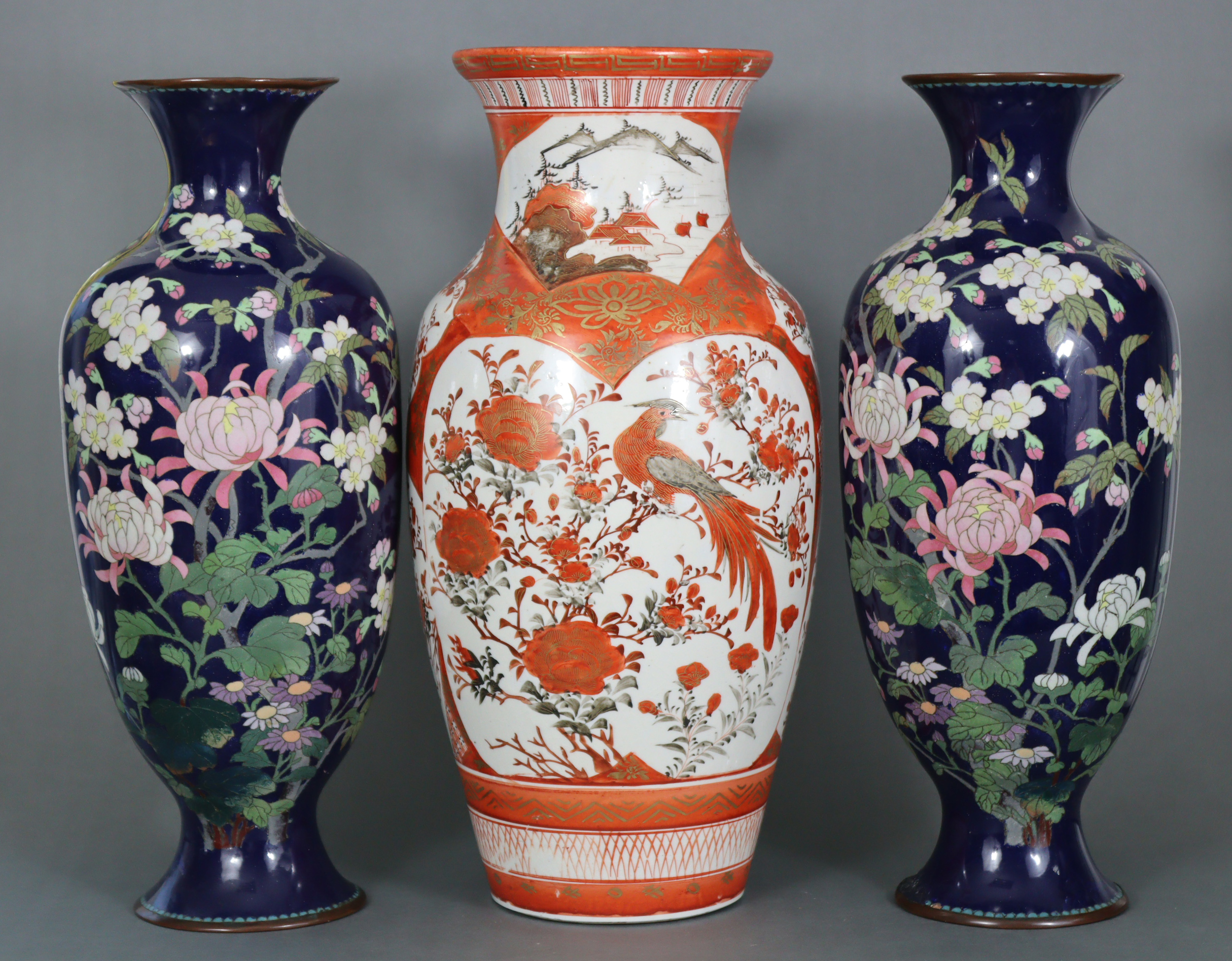 A Japanese Kutani porcelain baluster vase decorated with birds amongst foliage in reserves on an