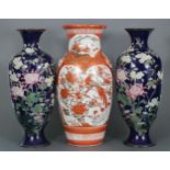 A Japanese Kutani porcelain baluster vase decorated with birds amongst foliage in reserves on an